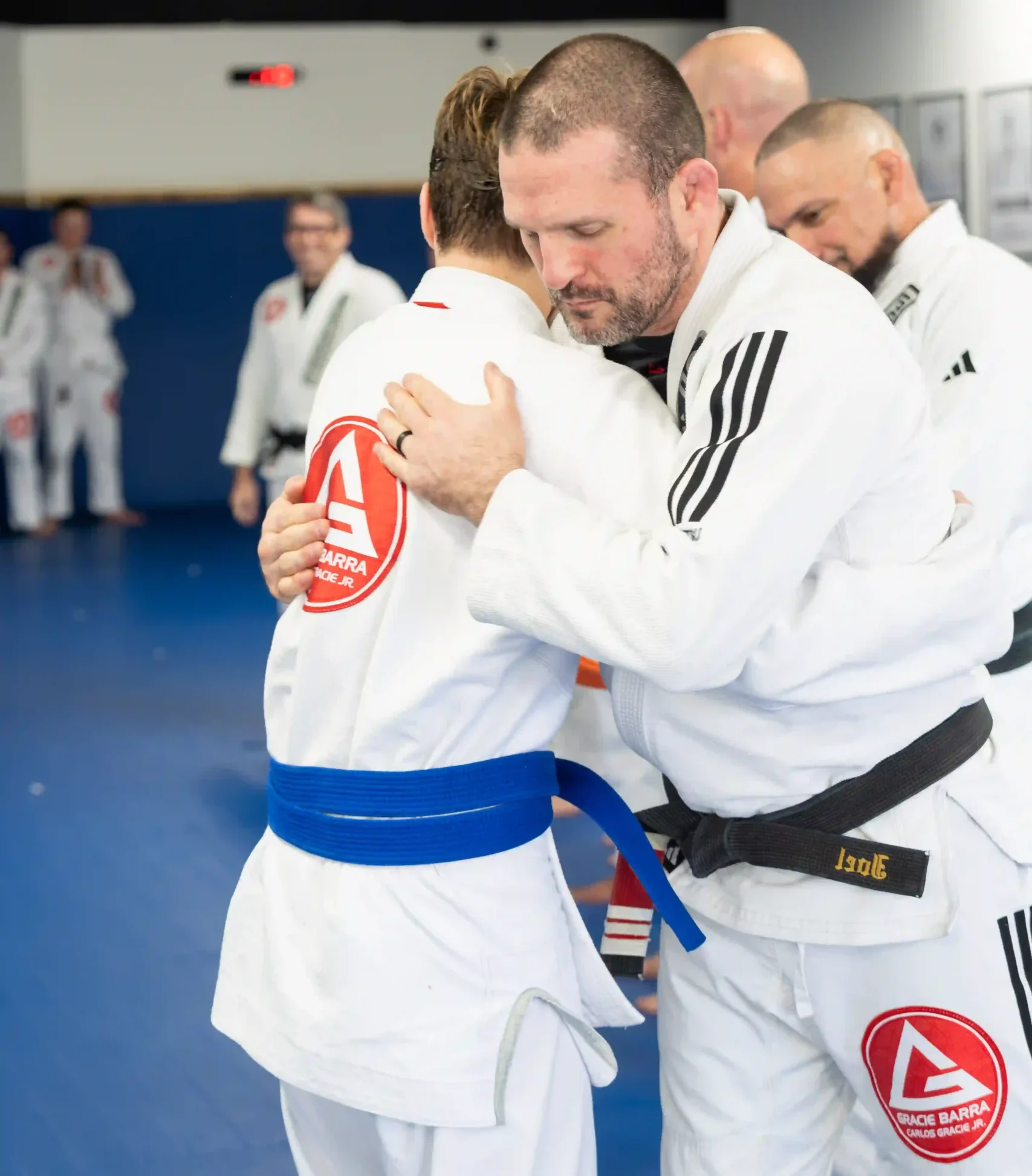 blue belt and a black belt in a bel cerimonial